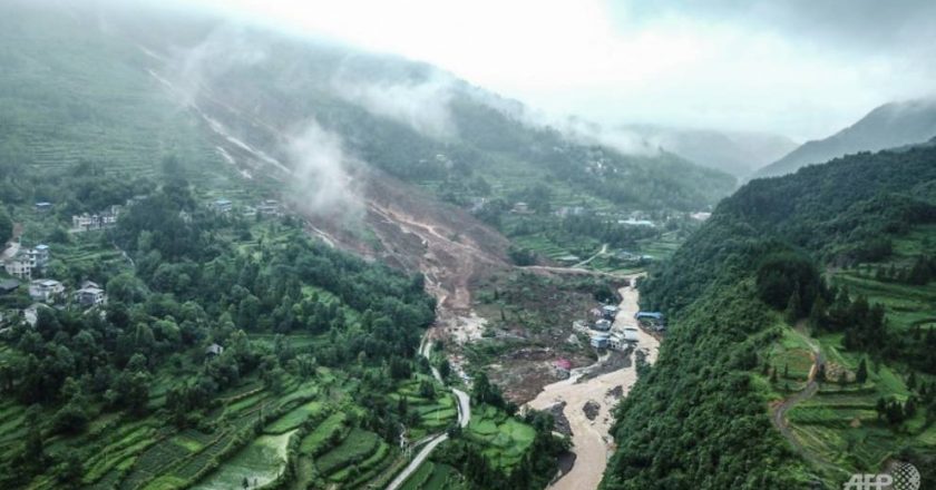 China landslides leave at least 14 dead or missing