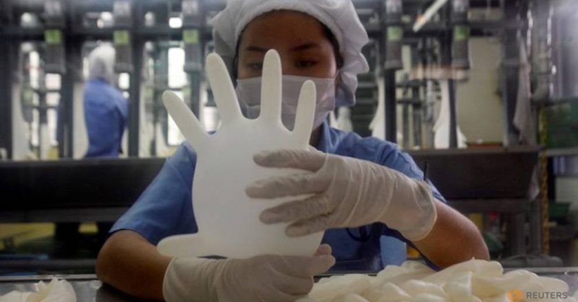 Amid virus crisis, US bars imports of Malaysia’s Top Glove over labor issues