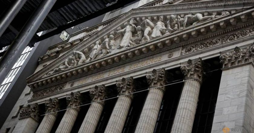 US stocks end higher after Powell projects stronger economy