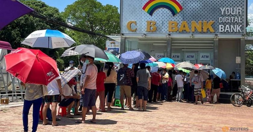 Lines, tokens and money brokers: Myanmar’s crumbling economy runs low on cash