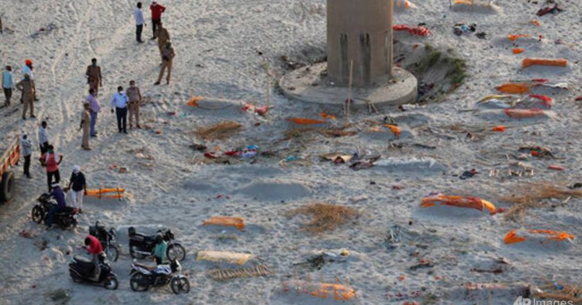 Indian police find bodies on riverbank amid raging COVID-19