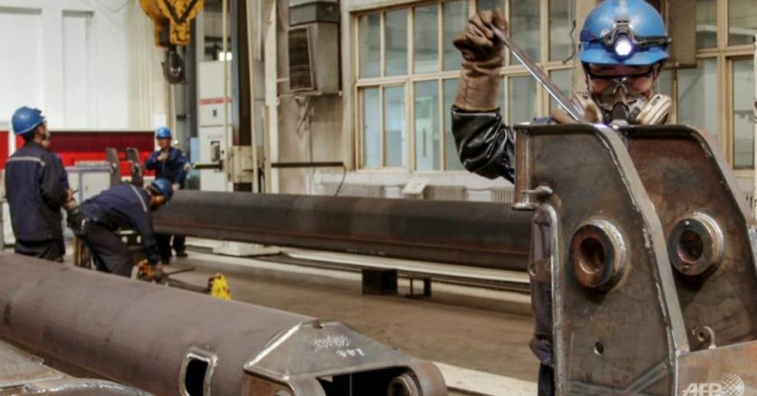 China factory activity edges down in June on tight supplies