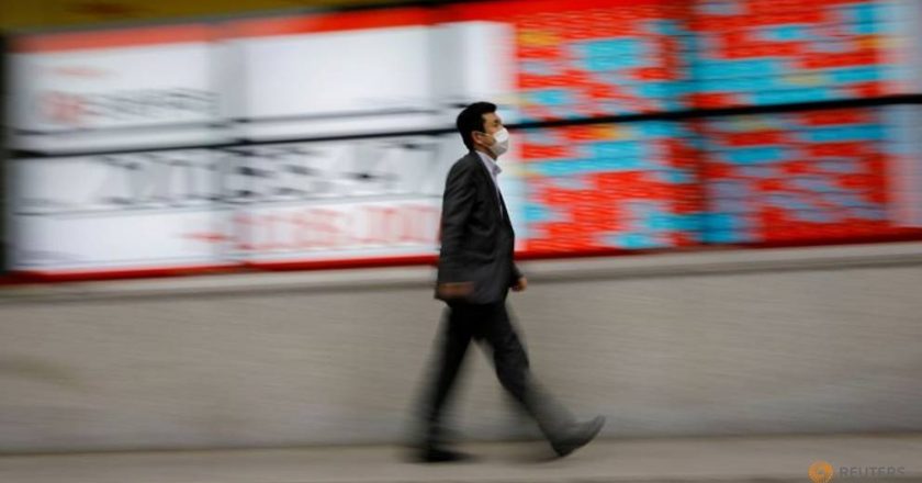 World shares cling near record highs