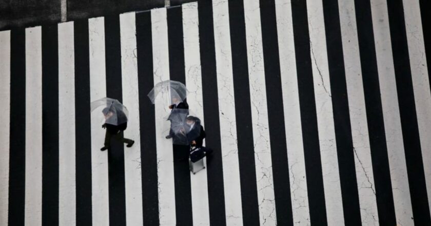 Japan raises view on production but signals Omicron risks